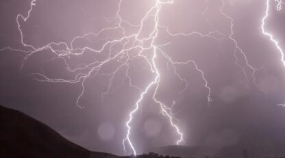 I bolt of lightning shooting down from the sky.