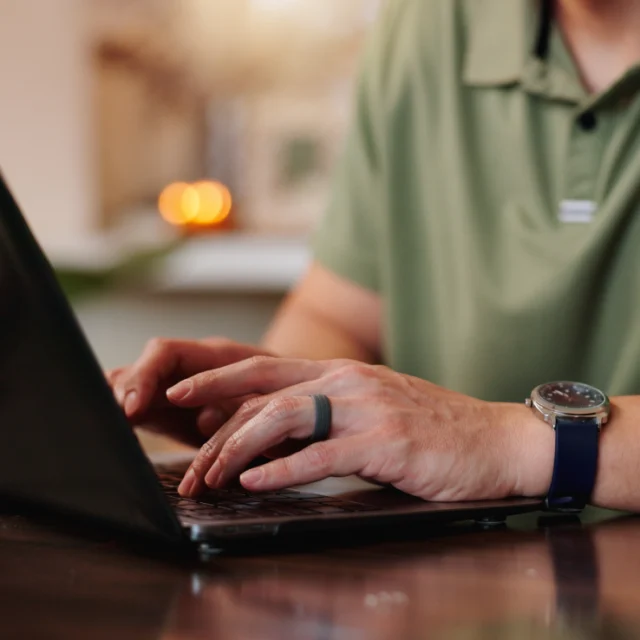 Person typing on laptop